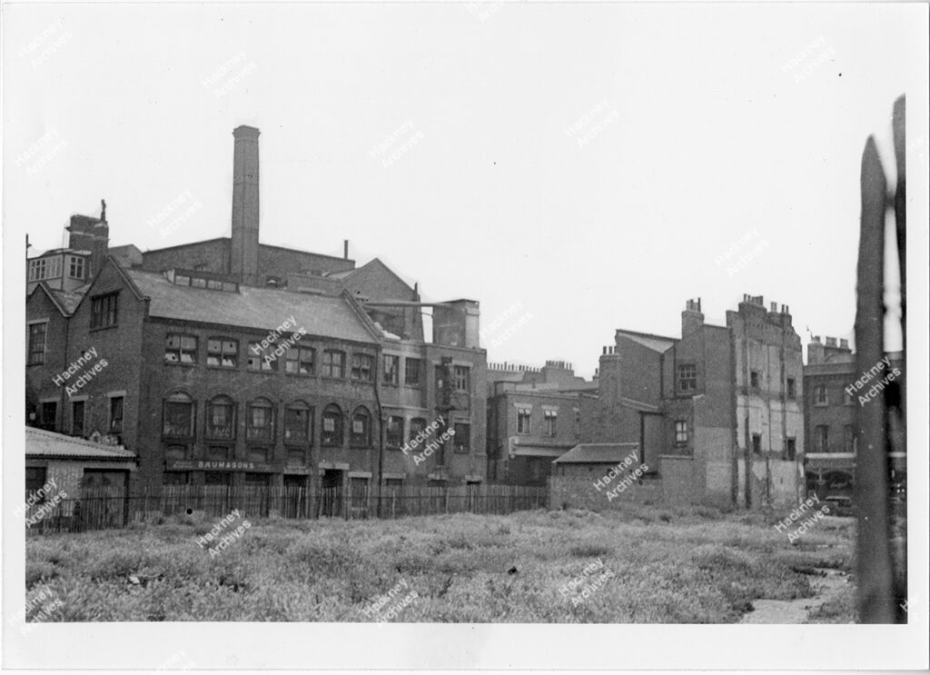 Baum & Sons, Boston Street, Shoreditch, Hackney, c.1955. south east view across a bombed site from Tuilerie Street, now the location of Hackney City Farm and Haggerston Park.