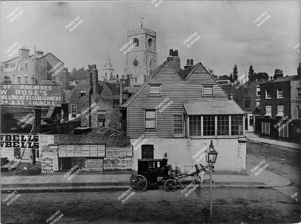 Amhurst Road and Mare Street Junction, Hackney, c.1866. Junction of Mare Street and Amhurst Road, looking towards Narrow Way and Old Hackney Church Tower taken from railway station. Includes buildings that had been The Eight Bells and site of Matthew Rose’s shop and a horse drawn carriage (Four wheel growler).
