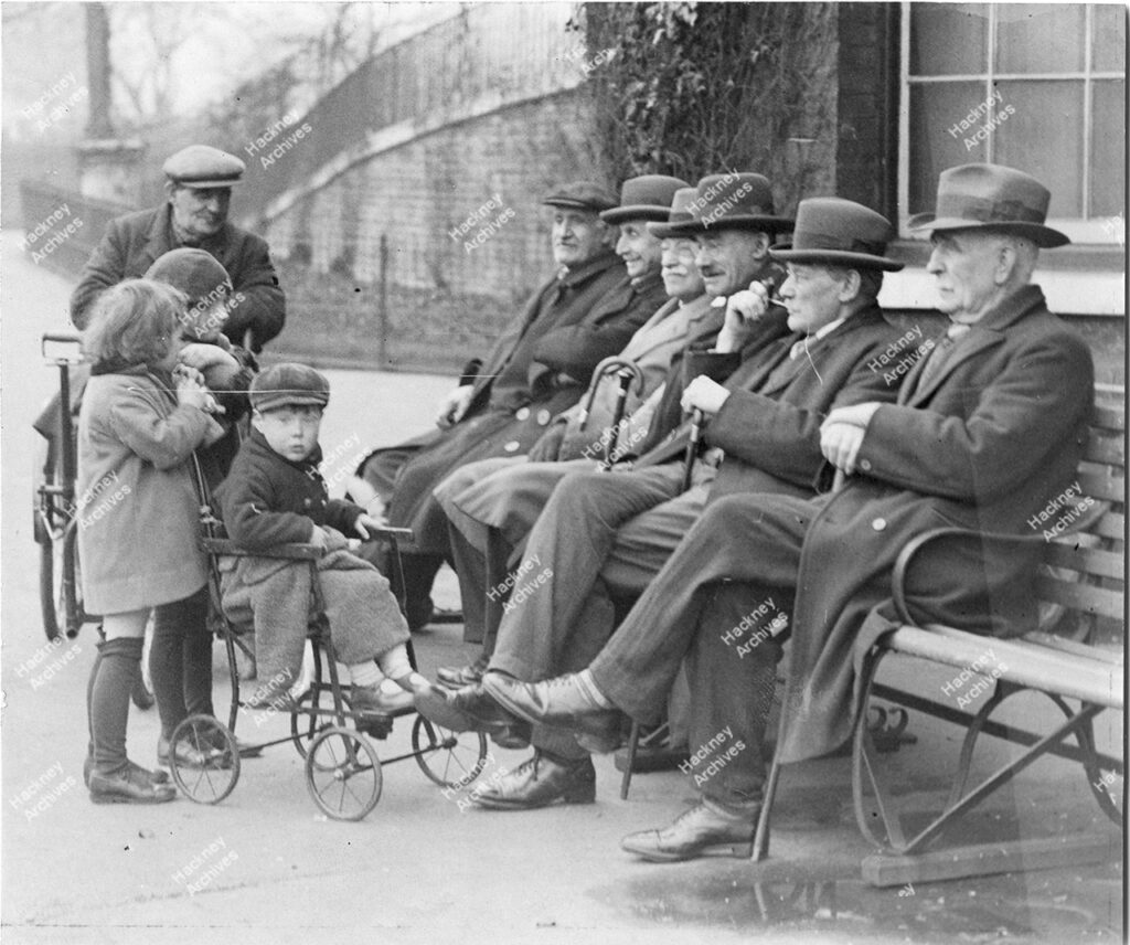 Old men sat on a bench, Clissold Park, Stoke Newington, Hackney. 1930.