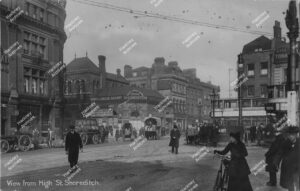 Shoreditch High Street and station, Shoreditch, Hackney, looking towards Old Street and Kingsland Road prior to building new station. Includes trams, horse and carts, c.1920.