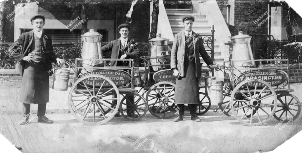 A. G. Jones (on left who later became a London bus driver 1914-58) and employees of Royal College Dairy, T. Brassington,  253 Amhurst Road with their milk churn barrows. The business was operated by Isabella Brassington between 1900-11.