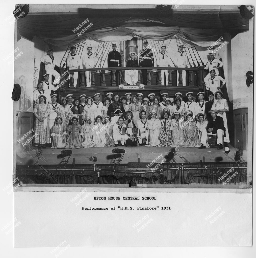 Group photo of pupils at Upton House Central School during a performance of H. M. S. Pinafore. 1931.