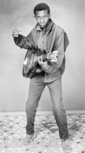 PORTRAITURE: YOUNG MAN WITH GUITAR