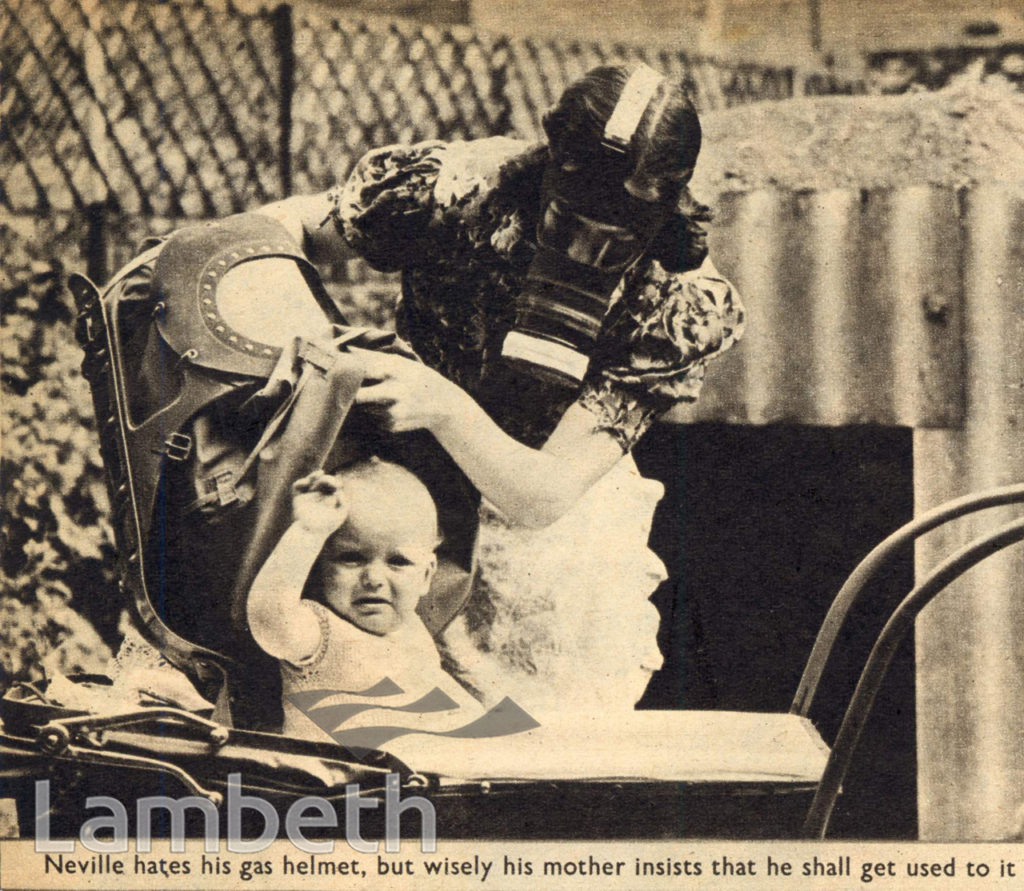 MOTHER & BABY WITH GAS MASKS: WORLD WAR II