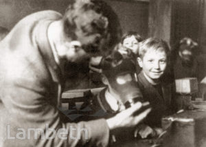 SCHOOLBOY EVACUEE WITH GAS MASK: WORLD WAR II