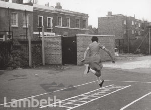 GIRL IN PLAYGROUND, EFFRA SCHOOL, BRIXTON