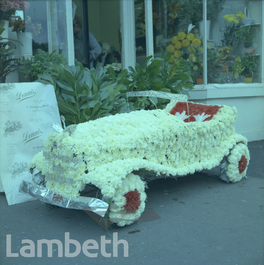 CHILD’S FLORAL CAR BY DENNIS, KENNINGTON