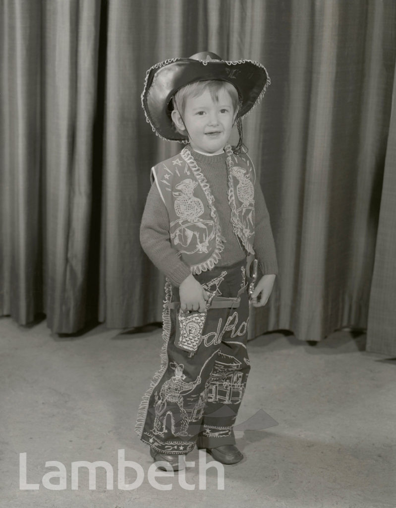 YOUNG BOY AS COWBOY, STUDIO PORTRAIT BY MANNING PHOTOGRAPHERS