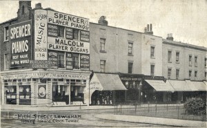 Murdoch’s Corner looking towards Clock Tower. Business advertising postcard showing prices of wares on reverse.