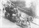 A C Van Der Bilt driving over Putney Bridge-